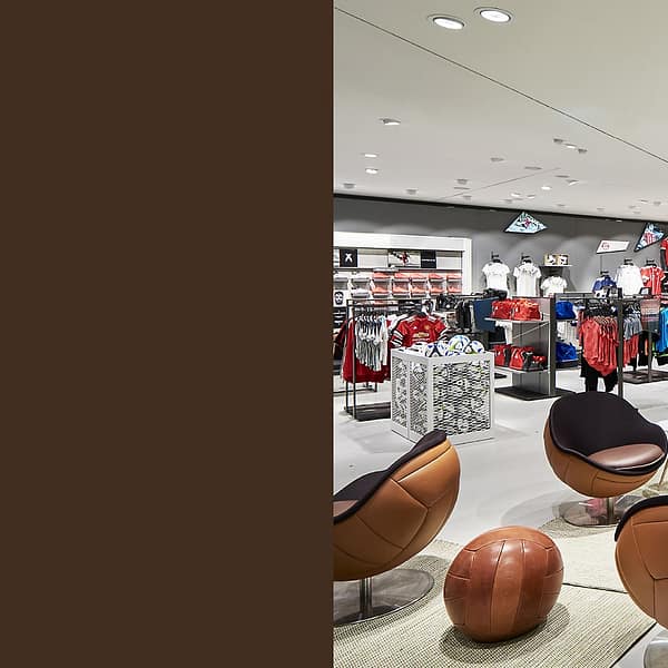 image of lillus by lento wembley retail design store fitting shop fitting luxury sports furniture made in germany loungechair ballchair football chair classic genuine leather brown sport style