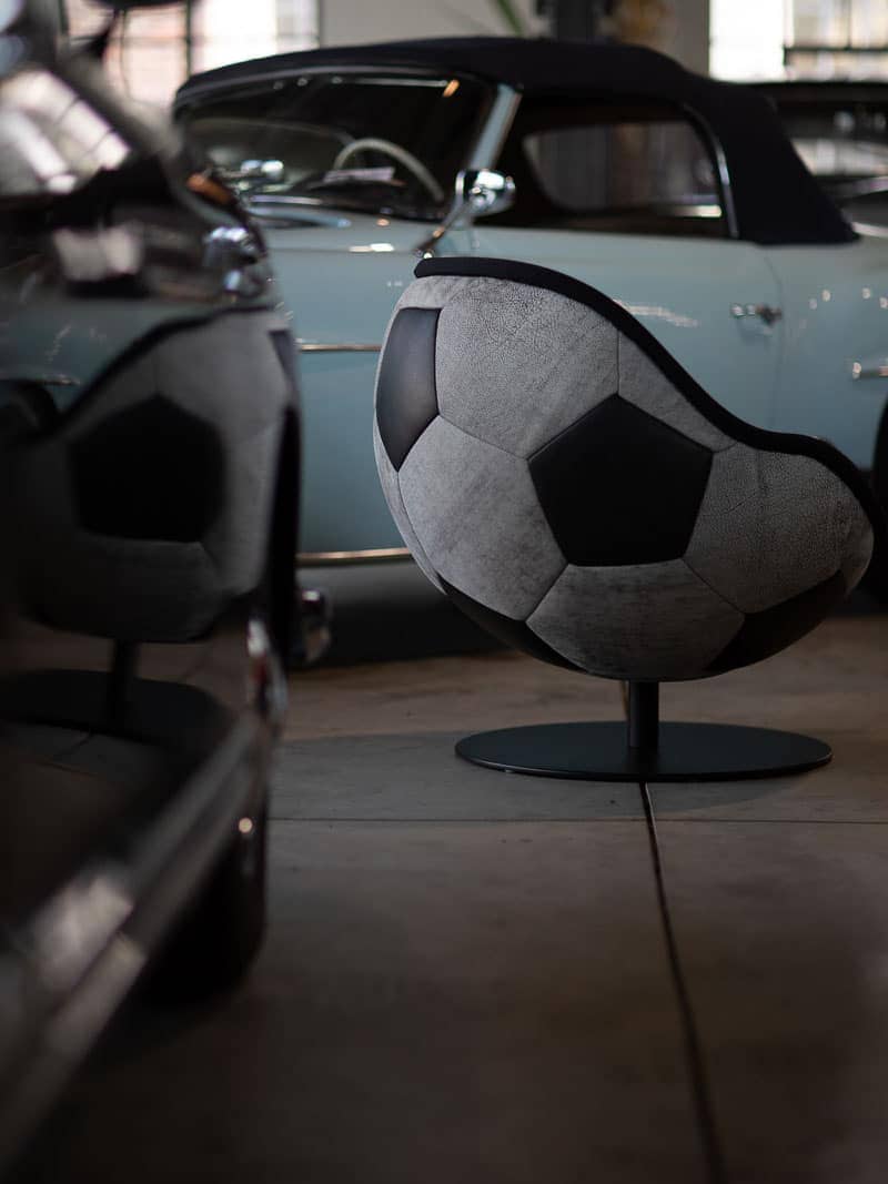 image of retro football chair vintage football chair in front of classic car Hot Rods hattrick lillus by lento lounge chair ball chair retro leather black white telstar football design retro interior design nostalgic style oft he 60-s