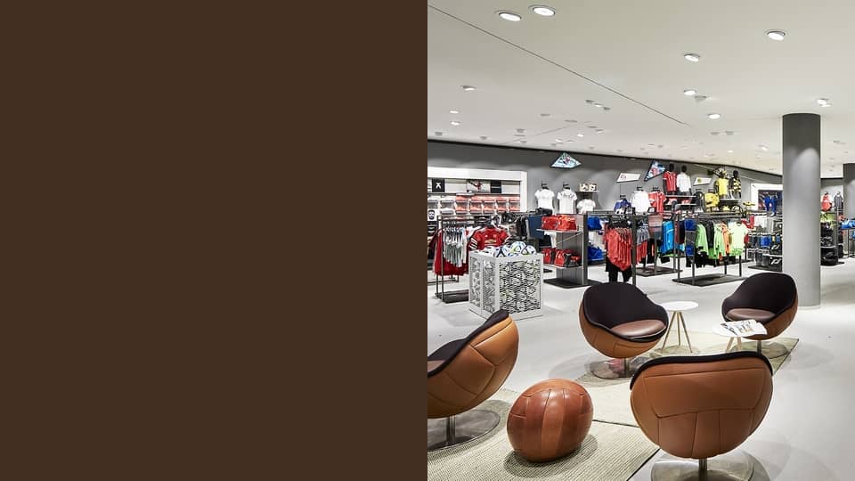 image of lillus by lento wembley retail design store fitting shop fitting luxury sports furniture made in germany loungechair ballchair football chair classic genuine leather brown sport style
