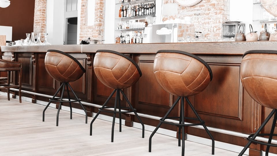 image of lillus by lento wembley barstool hospitality gastronomy interior design luxury sports furniture made in germany ballchair football chair vintage leather retro leather genuine leather brown sport style