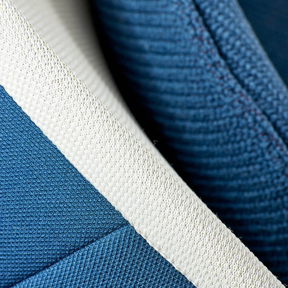 detail image of a lillus by lento classic lounge chair ball chair round chair in blue white knit design made in germany premium interior design for shop fitting retail design hotel areas