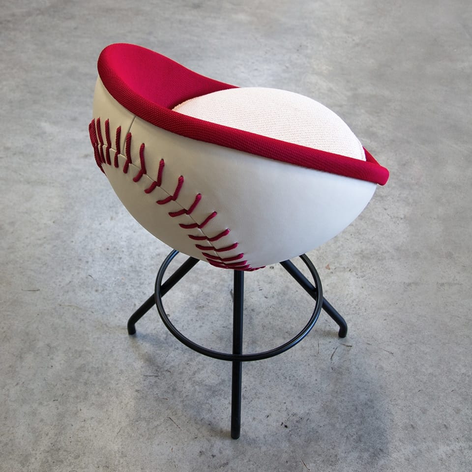 image of a lento counter stool lounge chair baseball chair in homerun baseball design in white and red coulour iconic sports furniture for sports mangement or gastronomy