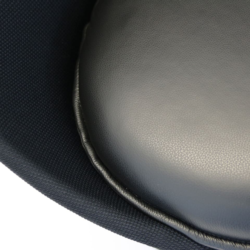 detail image of a lounge chair bar chair lillus by lento with a seat cushion in black leather unique sports furniture made in germany for sports industry
