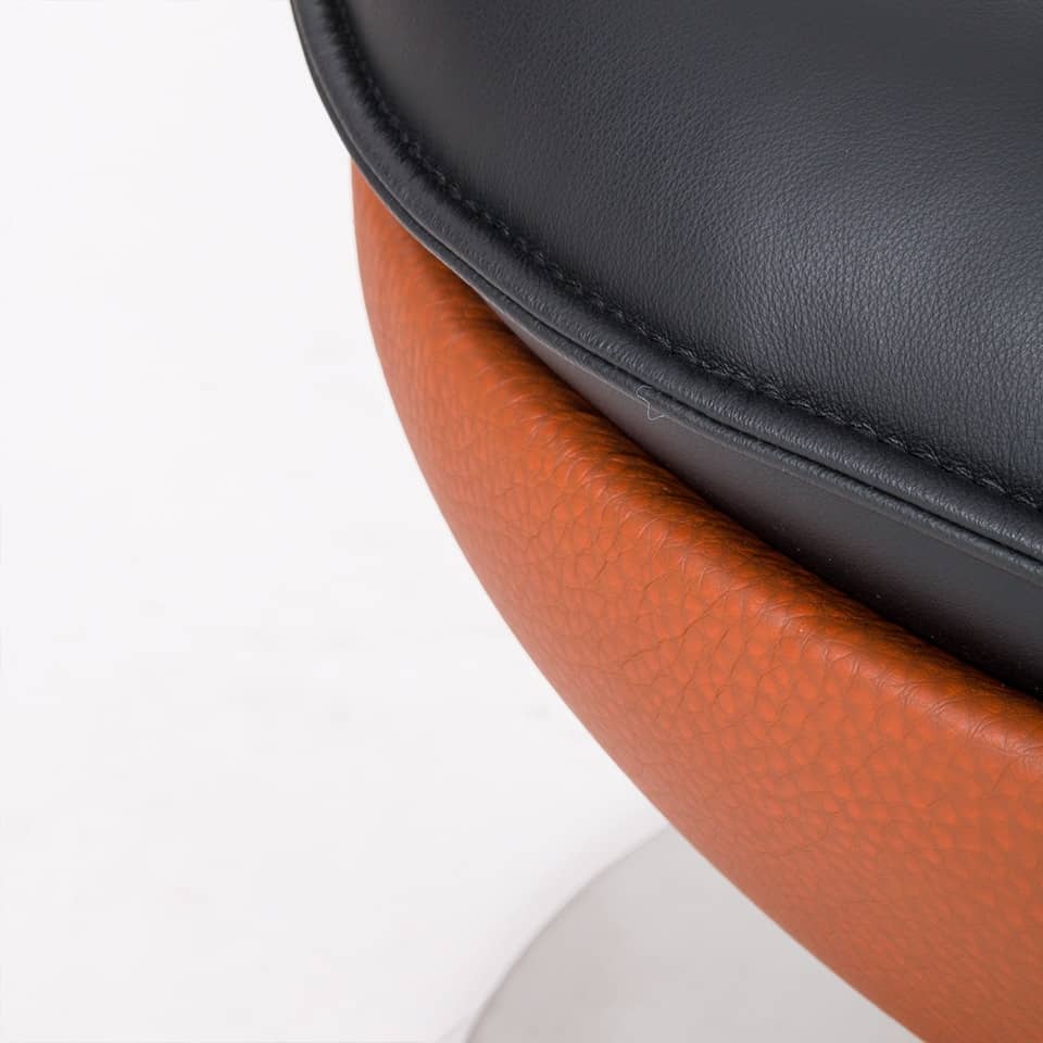 detail image of a lillus by lento foot stool basketball chair all net design with black leather seat cushion made in germany unique sports furniture for sports service gastronomy
